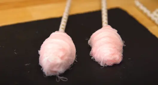 Hand pulled cotton candy wrapped in sticks