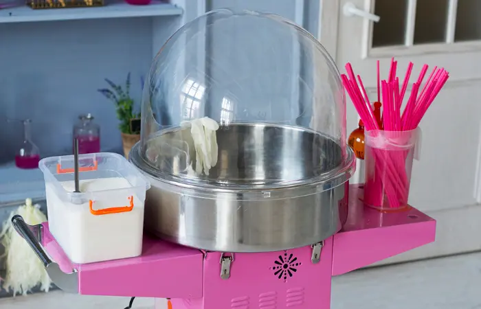 Cotton candy machine, sticks, and sugar