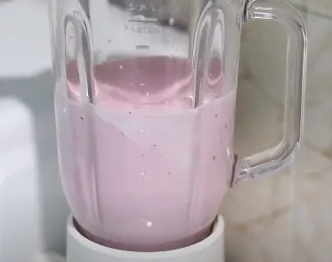 Blending-all-the-ingredients-for-making-strawberry-ice-cream