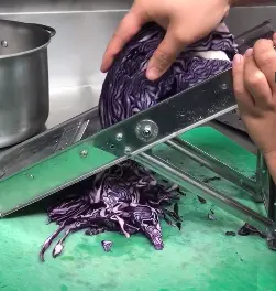 Shredding cabbage with mandolin