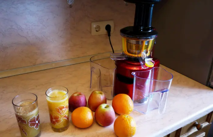 Placing juicer on countertop near electric outlet